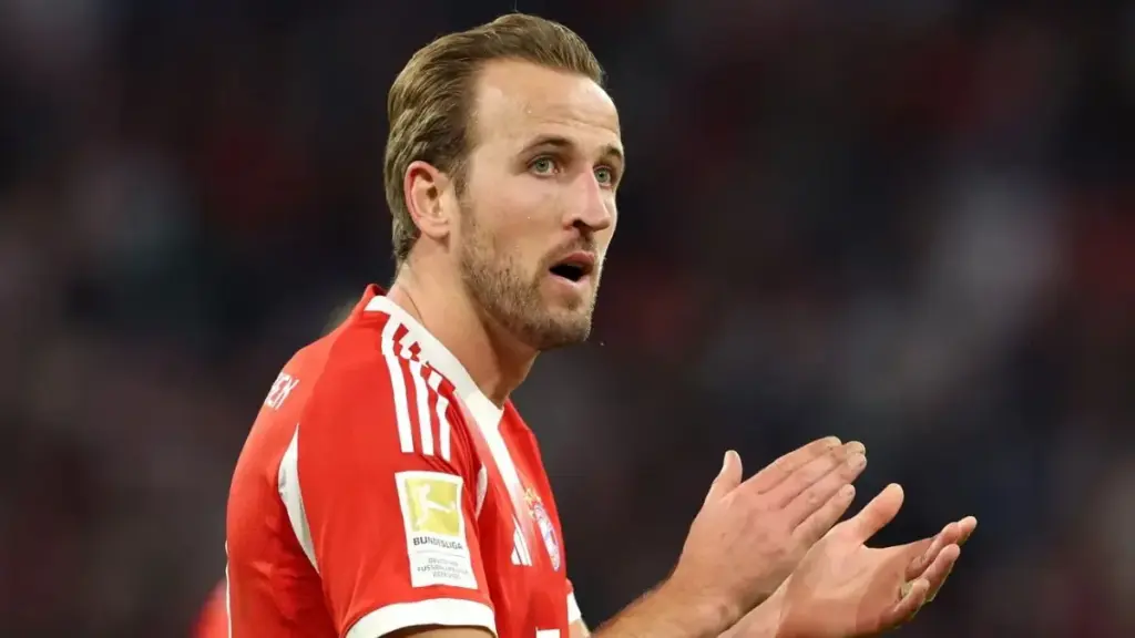 Harry Kane holding Bundesliga trophy 2026 Ballon d'Or frontrunner
